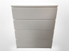 A contemporary white four drawer chest,