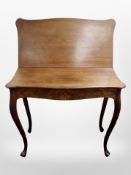 A 19th century mahogany turnover top table on cabriole legs,