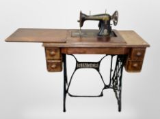 An antique Singer sewing machine in table