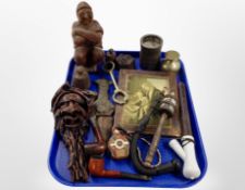 A group of pipes, a Russian-style icon, carved figure, cast iron weights, etc.