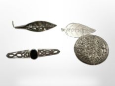 Four silver brooches