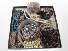 A quantity of costume jewellery, faux pearls, bangles, etc.
