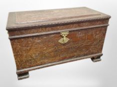 A heavily carved camphor wood blanket chest,