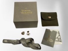 A pair of Vivienne Westwood earrings in retail pouch and box