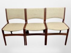 Three Danish teak dining chairs upholstered in oatmeal coloured fabric