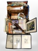 Two boxes containing wooden wares, trays, a pair of bookends, cigarette cards, vintage parasol,