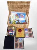 A wicker basket containing Yu-gi-oh! cards,