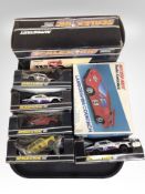 A group of Scalextric cars in boxes.