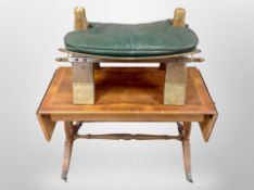 A reproduction drop leaf coffee table and a camel stool with green leather cushion