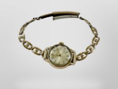 A lady's 9ct gold Tudor wristwatch on rolled gold bracelet.