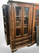 A reproduction mahogany double door bookcase,