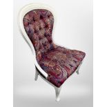 A Victorian style nursing chair in paisley pattern fabric