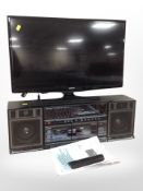 A Samsung 28 inch LCD TV with lead and remote,