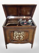 A Geisha gramophone in oak cabinet,