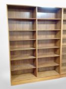 A pair of 20th century Danish teak open bookcases, with adjustable shelves,