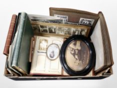 A box containing photograph albums, monochrome photographs, etc.