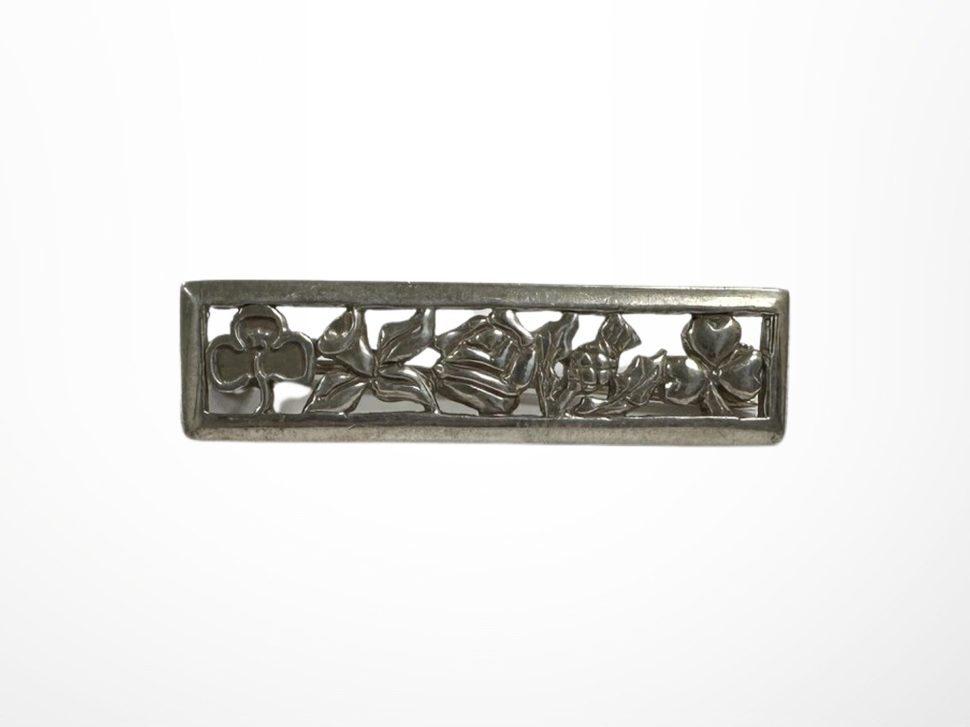 A silver bar brooch