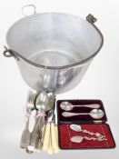 An aluminium jam pan and a small quantity of cutlery