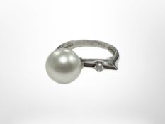 An 18ct white gold pearl and diamond ring.
