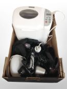 A box containing household electricals including breadmaking machine, hair products, etc.
