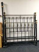 A cart iron and brass 4'6 bed frame