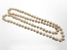 A long cultured pearl necklace