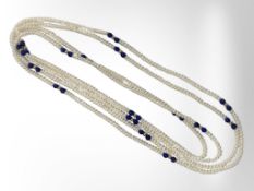 Two long strands of pearls with lapis lazuli and gold beads