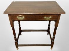 A George III oak side table fitted a drawer,