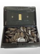 A cash tin containing assorted silver and other coins.