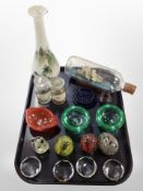 A group of glass ware including chemist's bottles, ship in bottle, crystal paperweights, etc.
