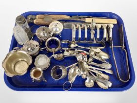 A group of silver-plated wares including toast rack, cutlery, preserved pots.