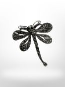 A silver marcasite dragonfly brooch