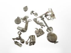 Sixteen assorted silver charms