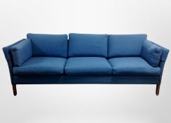 A late 20th century Danish three seater settee in blue upholstery,