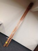 Fifteen lengths of copper pipe