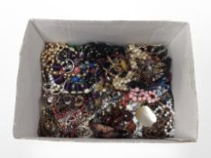 A box of costume jewellery, beaded necklaces,