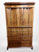 A 19th century Danish mahogany double door cabinet fitted four drawers beneath,