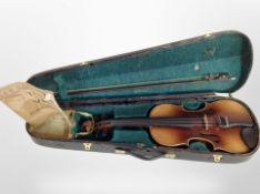 An early 20th century violin with two-piece 14" back, in coffin case with bow.