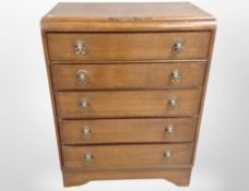 A 1930's oak five drawer chest,