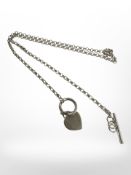 A silver chain with heart pendant and T-bar