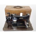A Jones hand sewing machine in case