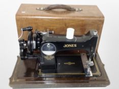 A Jones hand sewing machine in case