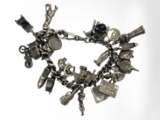 A silver charm bracelet on silver Albert chain 79.