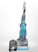 A Dyson upright vacuum cleaner