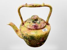 A large ceramic kettle with transfer-printed fruit decoration, height 31 cm.
