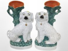 A pair of 19th century Staffordshire dog spill vases,