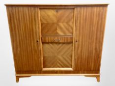 A 20th century Danish teak sideboard, fitted cupboards and drawers,