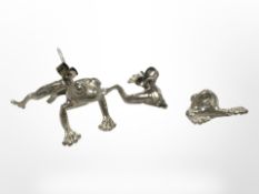 A pair of silver frog earrings