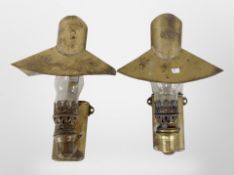A pair of brass oil lamps.