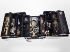 A concertina box containing costume jewellery, bead necklaces, bangles,